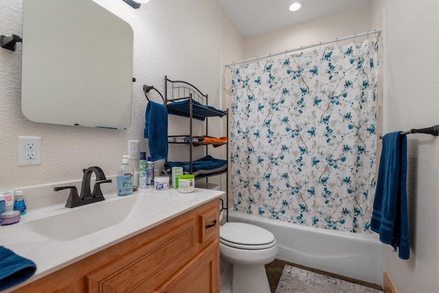 full bathroom with shower / bath combo, vanity, and toilet