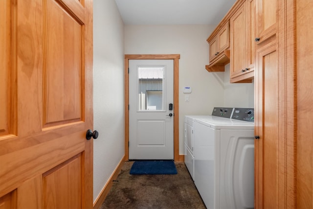 laundry area featuring cabinets, dark carpet, and washing machine and dryer