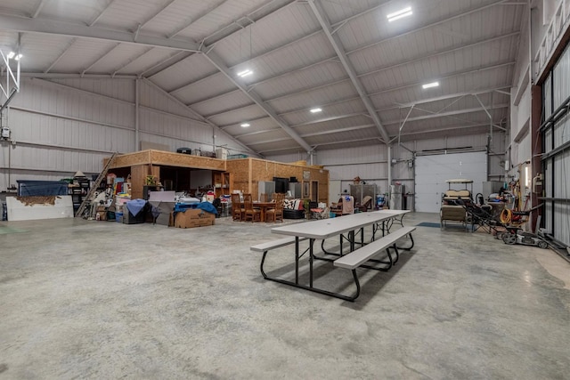 garage featuring a workshop area and metal wall