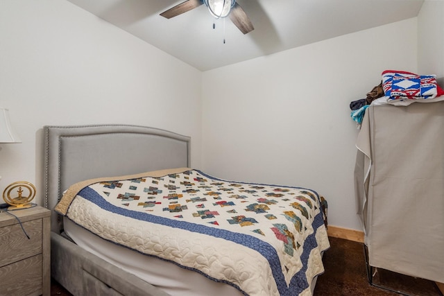 bedroom featuring a ceiling fan, carpet flooring, and vaulted ceiling