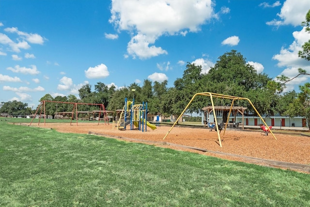 community jungle gym with a yard