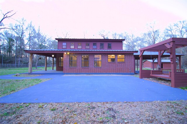 view of front of property featuring a carport