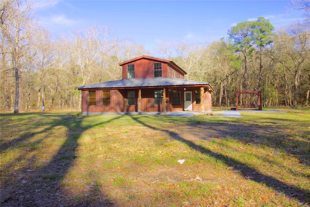 back of house featuring a yard