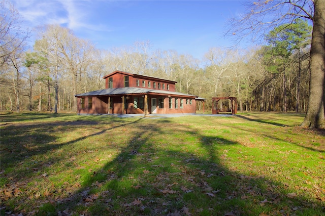 back of house with a lawn