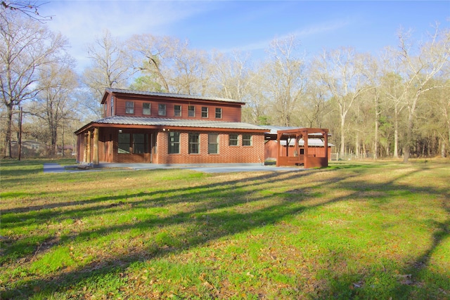 rear view of house with a lawn