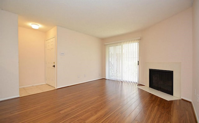 unfurnished living room featuring wood-type flooring