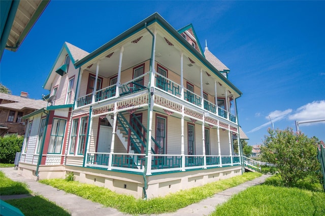 view of side of home with a balcony