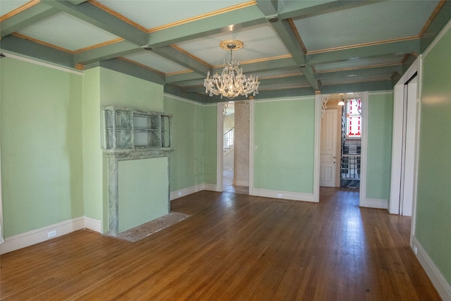 spare room featuring baseboards, coffered ceiling, dark wood-type flooring, beamed ceiling, and a notable chandelier