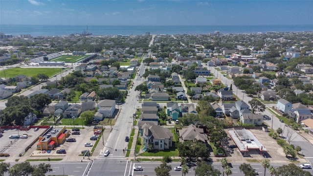 drone / aerial view with a residential view and a water view