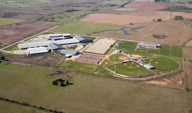 birds eye view of property with a rural view