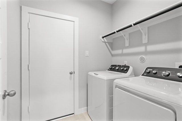 washroom with separate washer and dryer