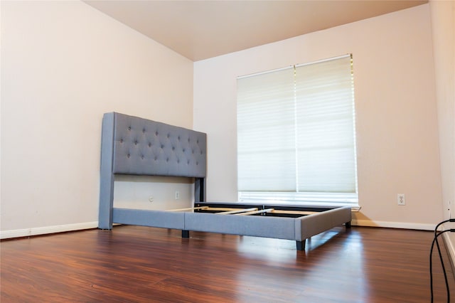 unfurnished room featuring dark hardwood / wood-style flooring