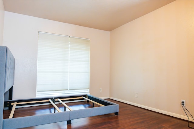 workout area with dark hardwood / wood-style floors