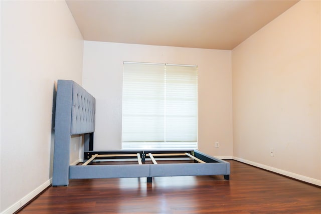 bedroom with hardwood / wood-style floors