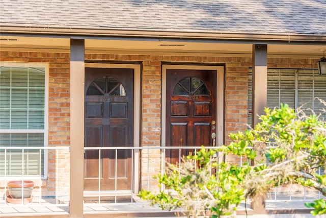 doorway to property featuring covered porch