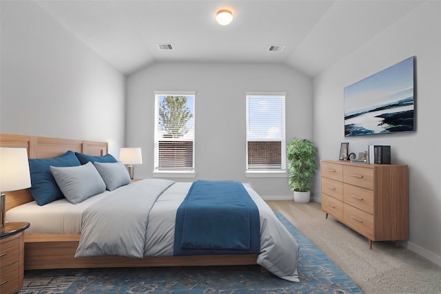 bedroom with vaulted ceiling and carpet floors