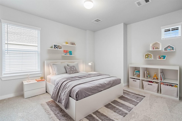 bedroom featuring light colored carpet