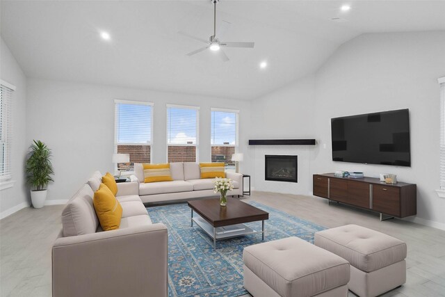 living room featuring ceiling fan, lofted ceiling, and light wood-type flooring