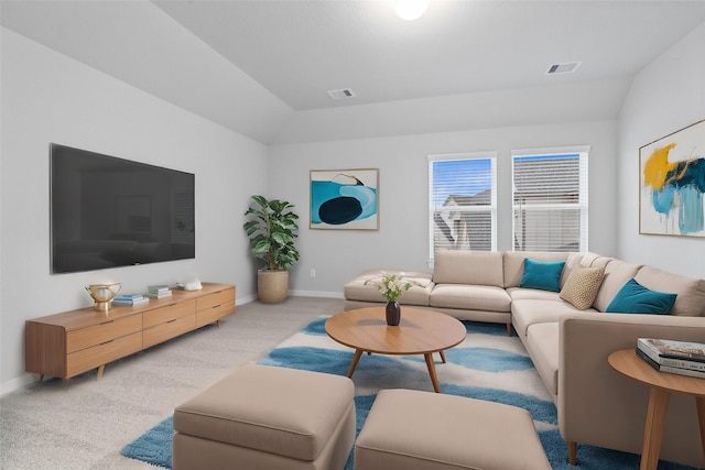 living room featuring lofted ceiling and light colored carpet