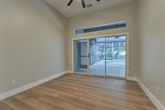 spare room featuring light hardwood / wood-style flooring and ceiling fan