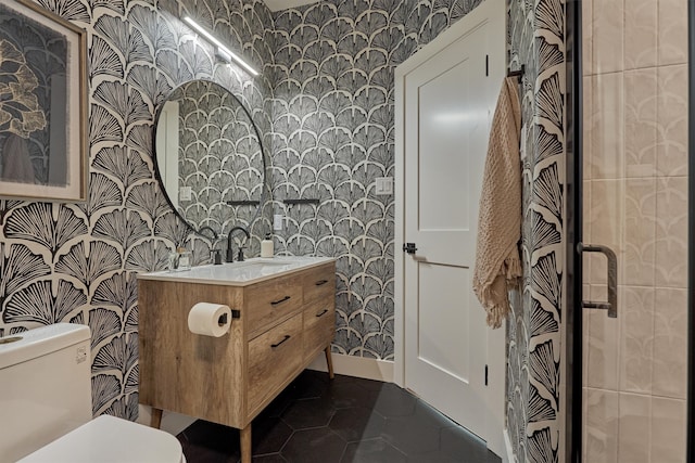 bathroom with tile patterned floors, vanity, and toilet