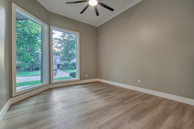 spare room featuring ceiling fan, light hardwood / wood-style floors, and crown molding