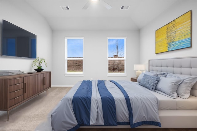 carpeted bedroom featuring vaulted ceiling and ceiling fan