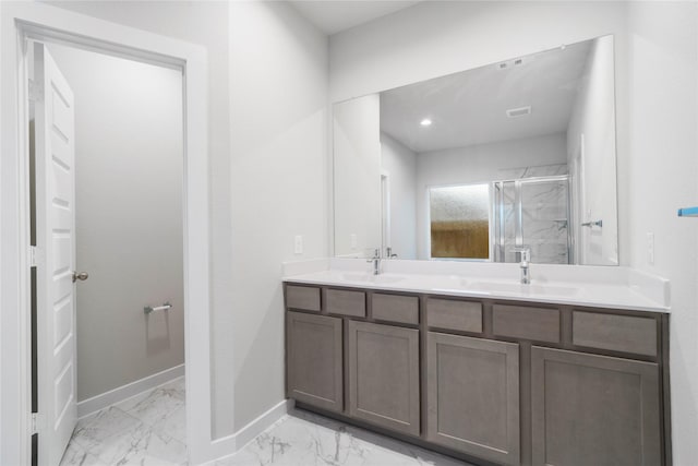 bathroom with vanity and an enclosed shower