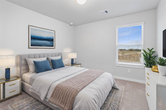 bedroom with light colored carpet