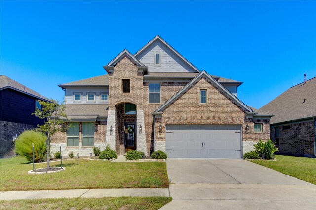 view of front facade featuring a front lawn and a garage