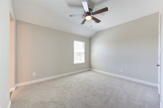 unfurnished room with ceiling fan, light colored carpet, and lofted ceiling