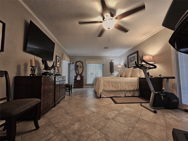 tiled bedroom with ceiling fan, ornamental molding, and a textured ceiling