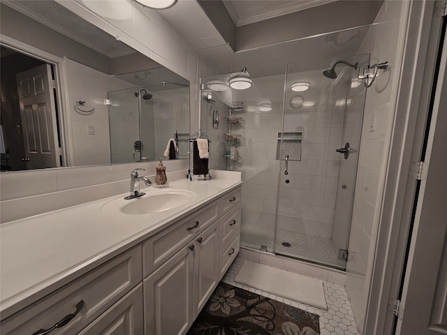 bathroom featuring tile patterned floors, ornamental molding, vanity, and a shower with shower door