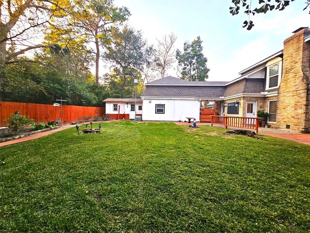 view of yard featuring a wooden deck