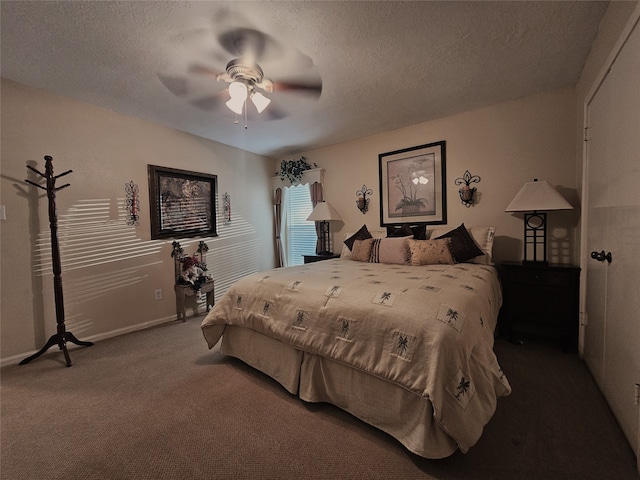 carpeted bedroom with ceiling fan and a textured ceiling