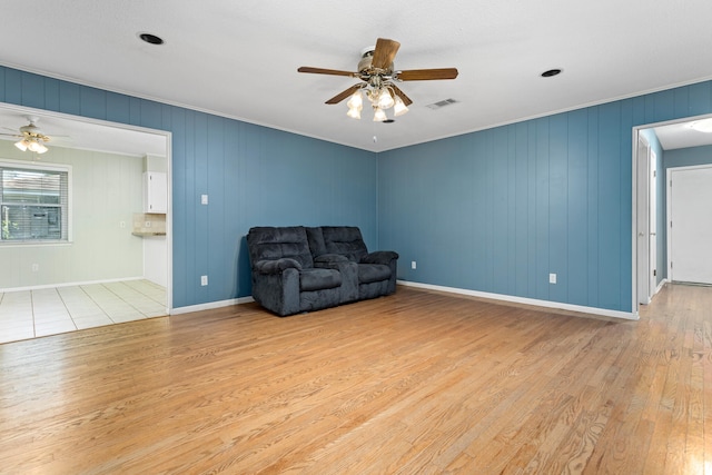 unfurnished room with ceiling fan and light hardwood / wood-style flooring