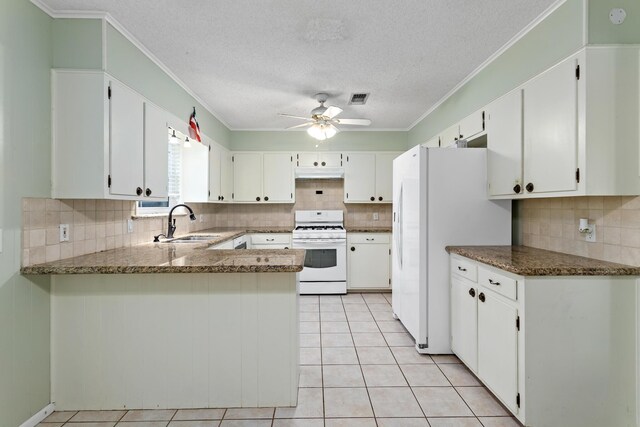 kitchen with kitchen peninsula, white cabinetry, white appliances, and light tile patterned floors