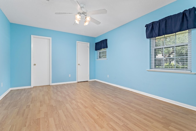 unfurnished bedroom with light hardwood / wood-style flooring and ceiling fan