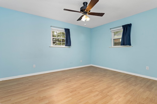 unfurnished room featuring ceiling fan and light wood-type flooring