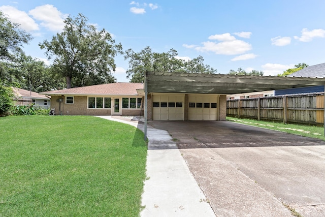 ranch-style house featuring a front lawn and a carport