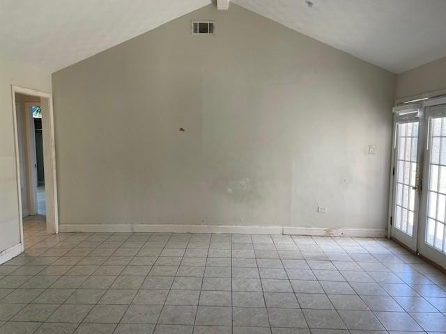 spare room with visible vents, beam ceiling, french doors, light tile patterned floors, and baseboards