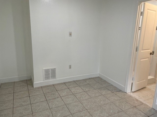 view of tiled spare room