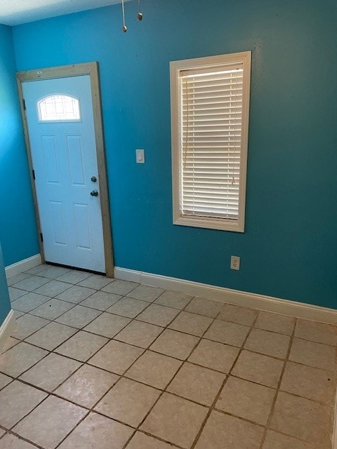 foyer with light tile patterned floors