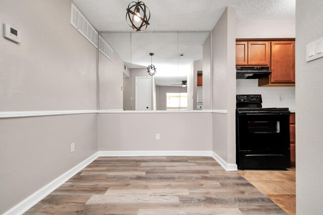 kitchen with exhaust hood, light hardwood / wood-style flooring, tasteful backsplash, ceiling fan, and black electric range oven