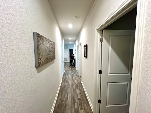 hallway with dark wood-type flooring