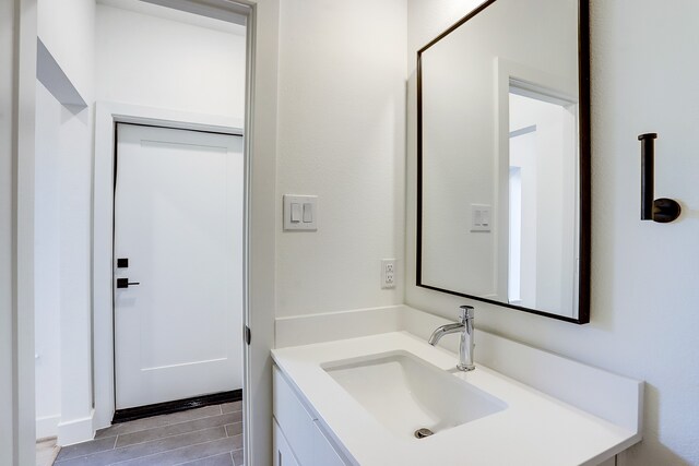 bathroom with tile patterned flooring and vanity