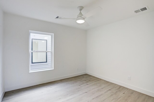 spare room with light hardwood / wood-style floors and ceiling fan