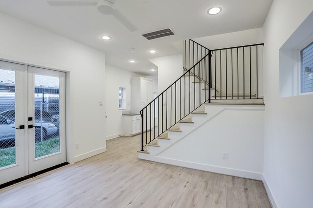 interior space featuring ceiling fan, hardwood / wood-style flooring, and french doors