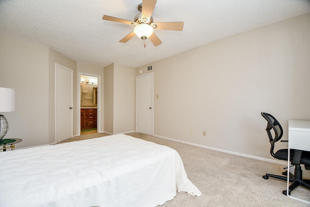 bedroom with baseboards, ceiling fan, carpet, and a textured ceiling