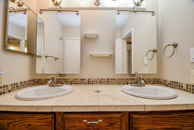 full bath with double vanity and a sink